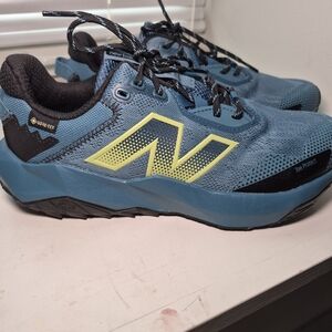 New Balance Blue Trail Running Shoes with Yellow Logo